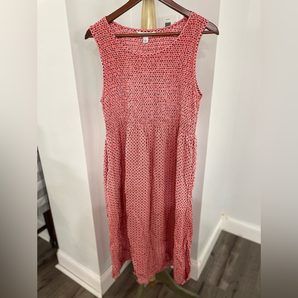 Sleeveless coral maxi dress.